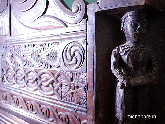 Palanka (Decorated Bed) � Four corners (Legs) of this Palanka has been decorated as four armed guards. Mr. Pinaki Nandan Das Mahapatra is the present owner of this palanka. From his early days he always kept distance from this Palanka as he used to fear these 4 guards as well as the then owner (his father) of this Palanka very much. He never gets an opportunity to use this Palanka from his childhood. But, after his father passed away it was his turn to use the Palanka. Yes, he tried few times to use the Palanka, but he could not sleep well. Guess why? Because of those four guards, every night they used to come in his dreams. So, he decided to use the Palanka for guests. Naturally if you go there as his guest, you will may get an opportunity to rest on it, as I got. Unfortunately those 4 guards never came to my dreams; it seems they only love Mr. Pinaki Nandan Das Mahapatra.  